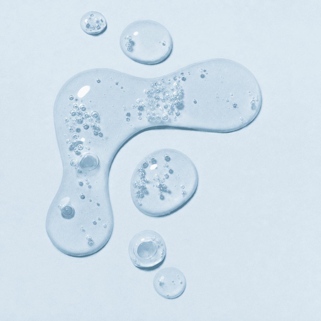 Macro close-up of clear hypochlorous acid beading into droplets