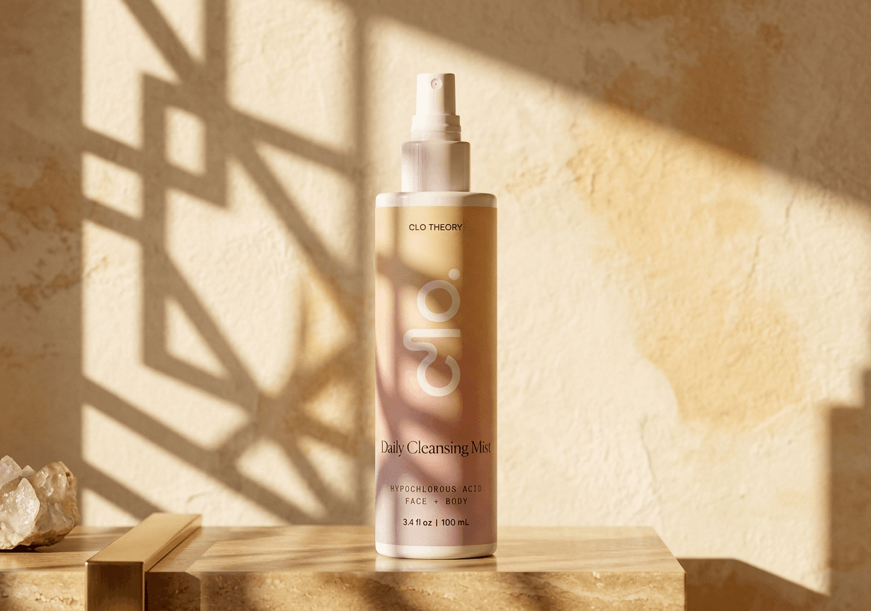 Clo Daily Cleansing Mist bottle on a travertine shelf with soft geometric shadows