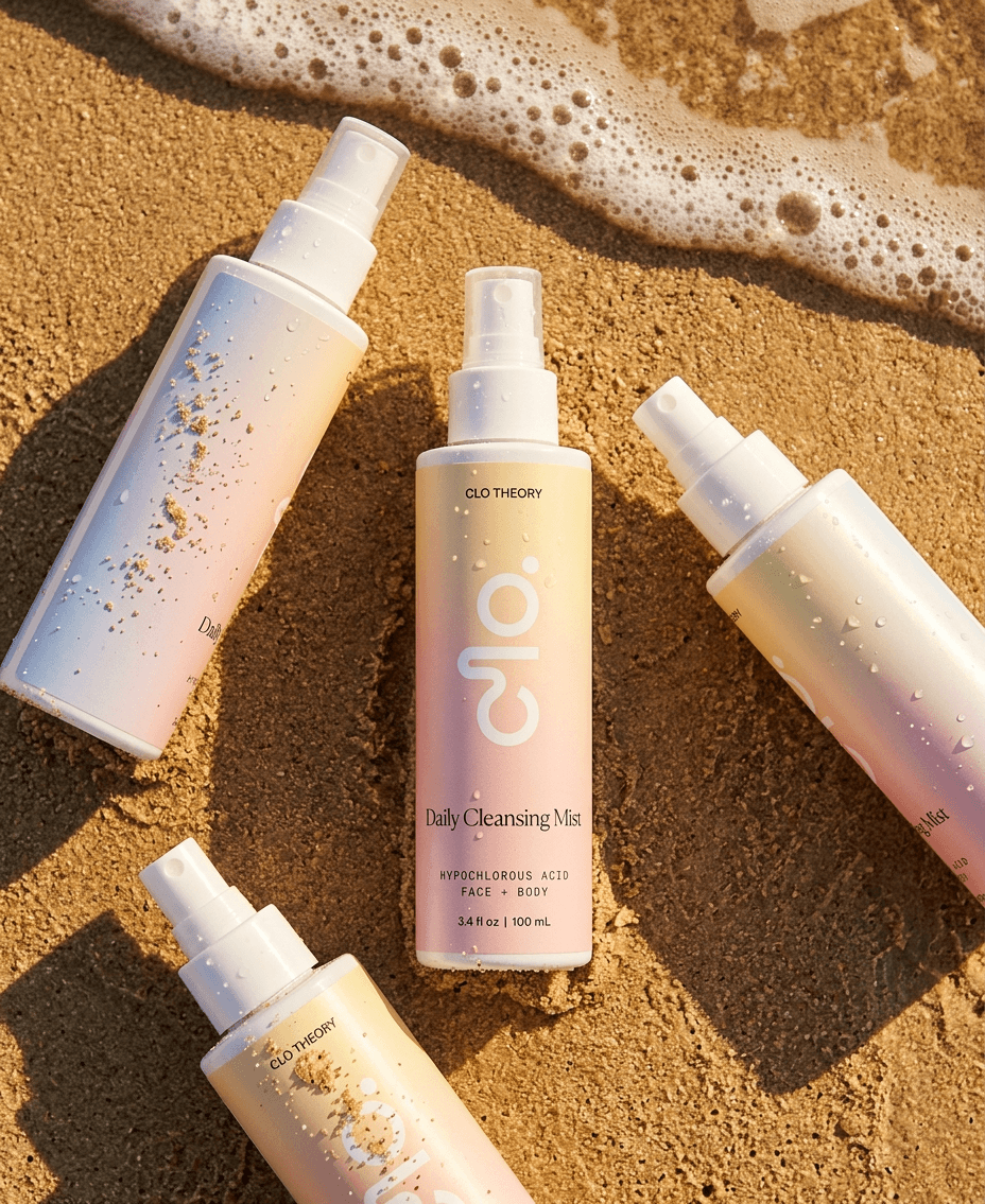 Clo bottles on wet sand, caught where a wave meets the shore