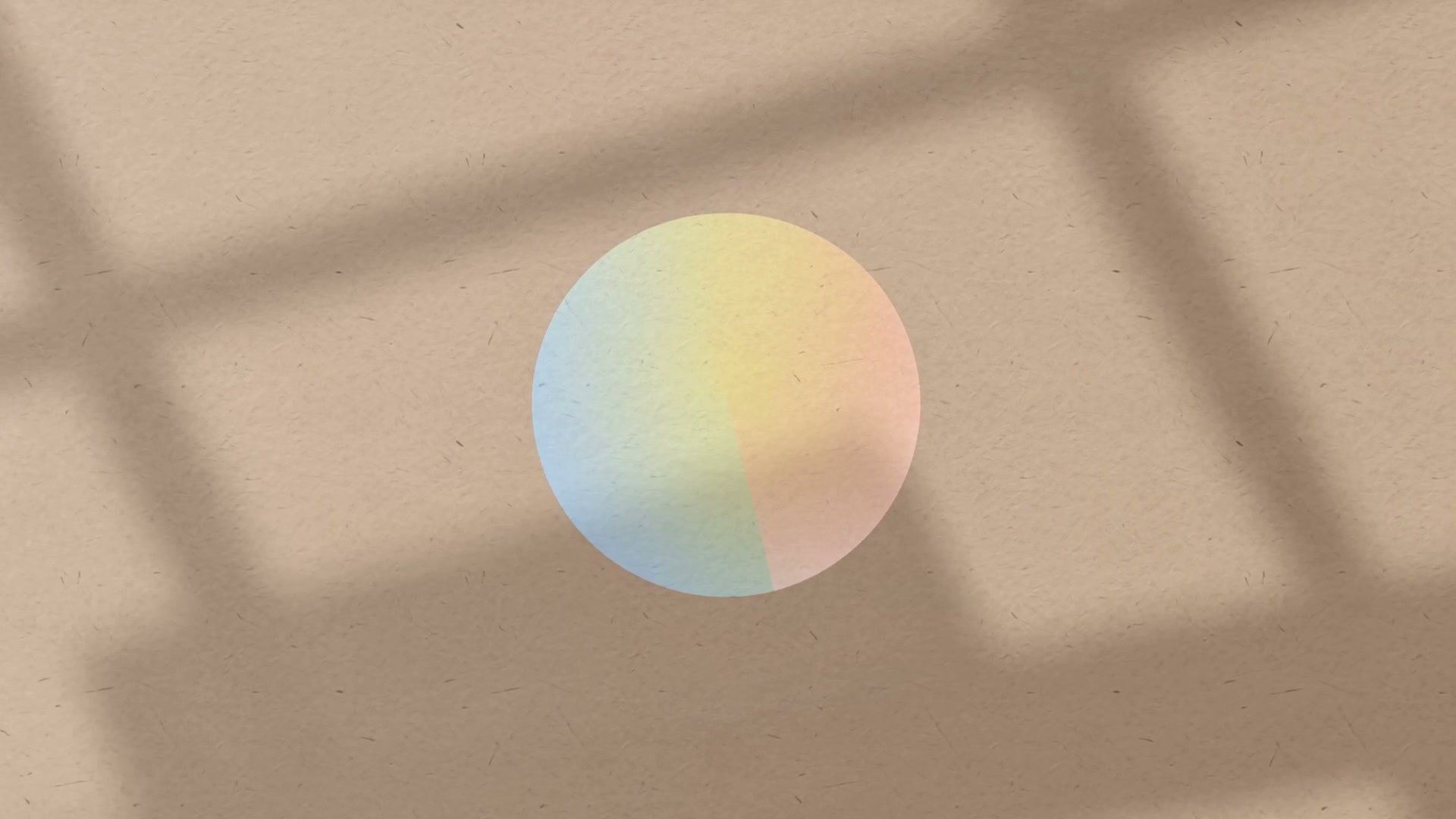 Soft pastel CLO circle on a textured background with window shadows